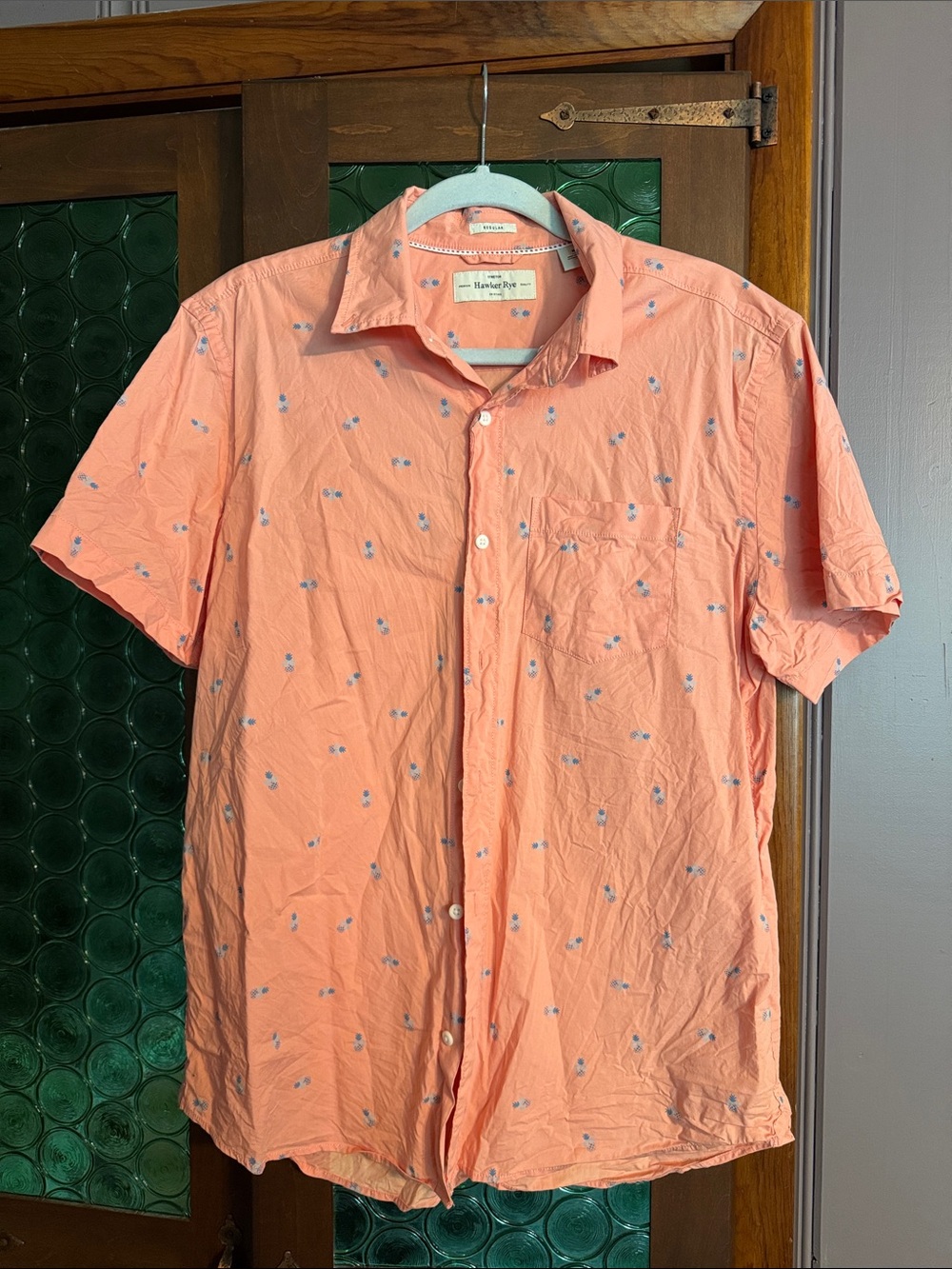 Men's Peach Short-Sleeve Button-Down Shirt with Subtle Blue Motif